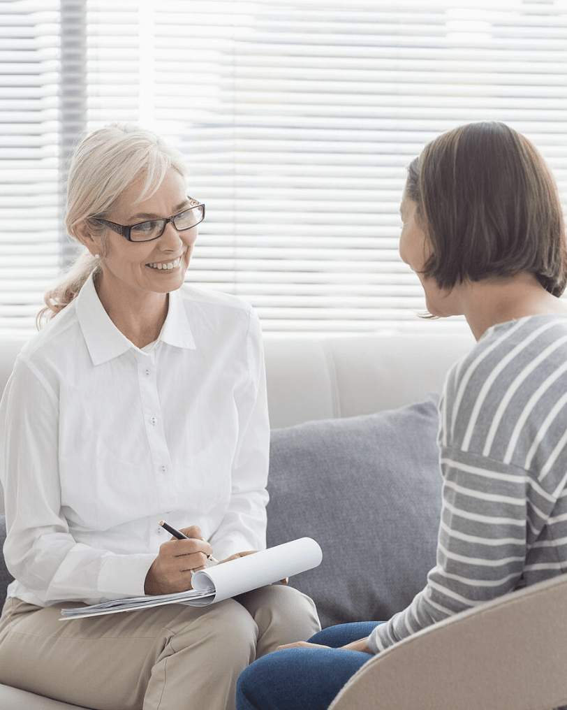 psychiatrist talks to a girl about drug rehab