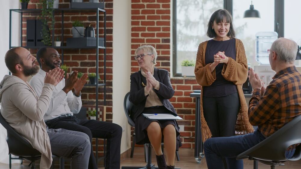 A therapy group celebrating recovery success. 