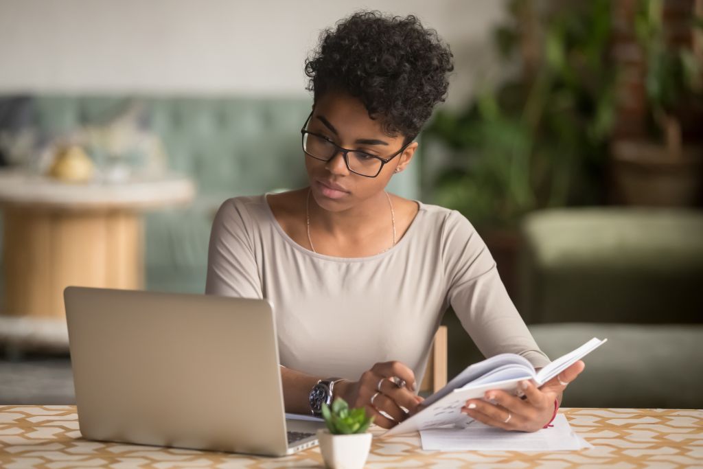 A woman researching on her laptop