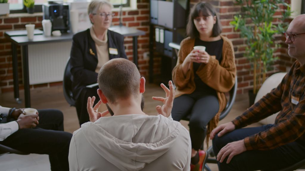 People talking in group therapy